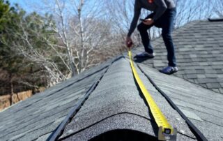 Professional contractor performing roof repair on residential home.